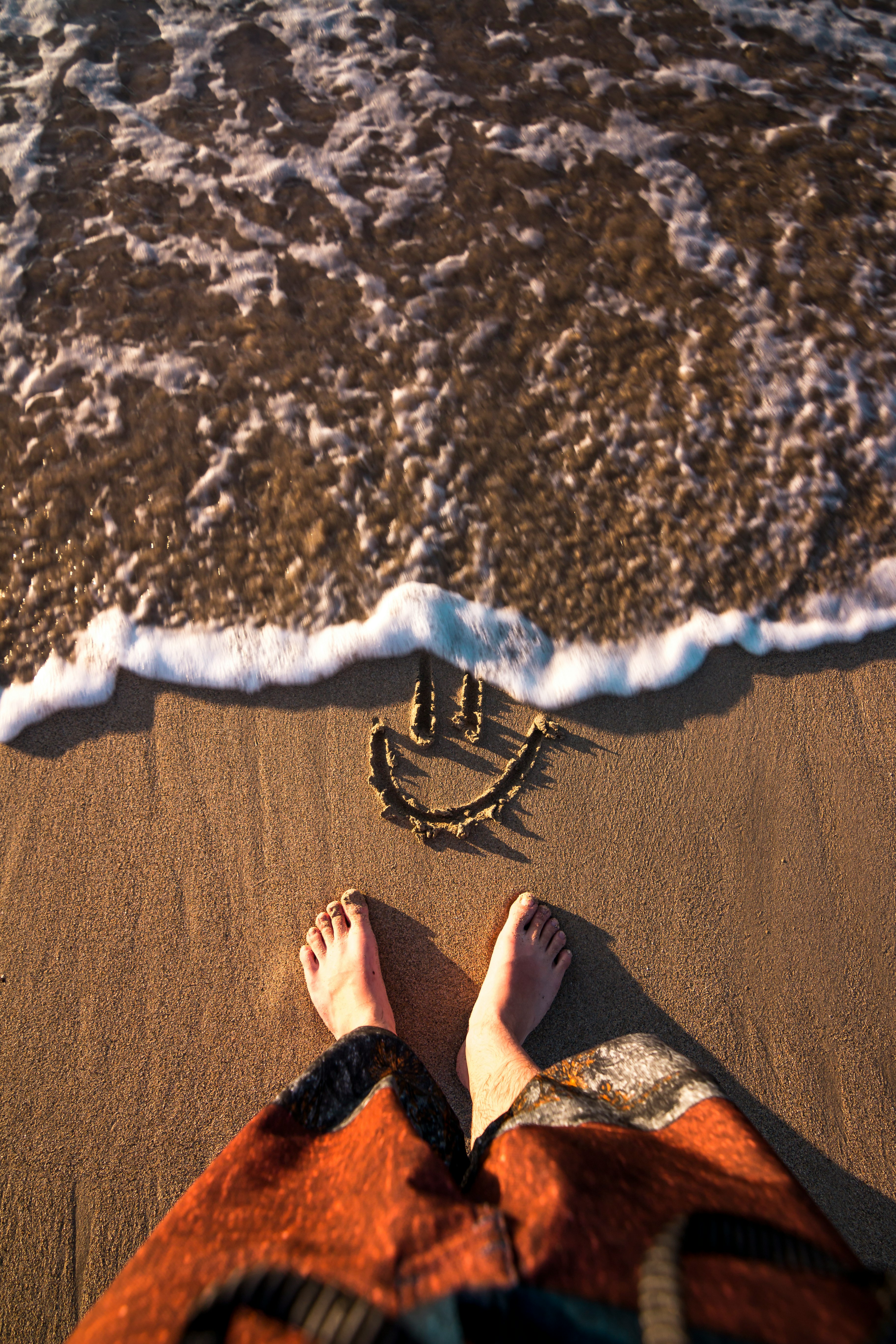 smiley doodle on sand